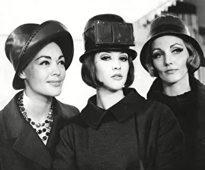 Trio of models wearing leather hats Trio of models wearing leather hats