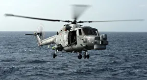 Helicopter Capturing Images Of A Lynx Landing On HMS Cornwall Helicopter Capturing Images Of A Lynx Landing On HMS Cornwall