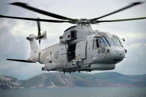Prints of A Royal Navy Merlin helicopter taking part in an exercise over the south of England. Merlin Mk1 the worlds most potent submarine hunting helicopter World War I Prints: A Royal Navy Merlin helicopter in flight over the south of England, Print