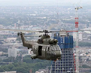 RAF Puma HC1 Helicopter Flies Past The Shard Skyscraper, London RAF Puma HC1 Helicopter Flies Past The Shard Skyscraper, London