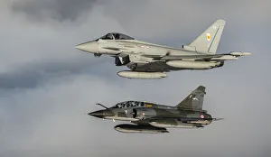 RAF Typhoon and French Mirage Flying together RAF Typhoon and French Mirage Flying together