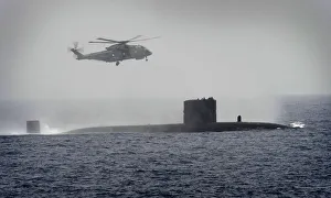 Royal Navy Submarine HMS Turbulent with a Merlin Helicopter from HMS St Albans Royal Navy Submarine HMS Turbulent with a Merlin Helicopter from HMS St Albans