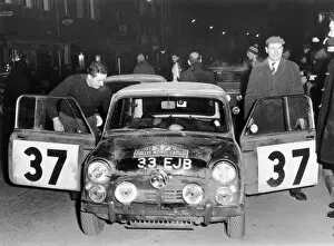 Images Dated 10th November 2004: 1964 Monte carlo Rally. Paddy Hopkirk and co-driver Liddonwith their winning Mini Copper