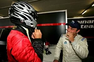 Images Dated 7th August 2004: Altech Minardi F1x2 Grand Prix: Gabriele Lancieri chats with Patrick Friesacher Minardi