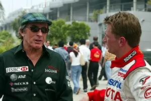 Images Dated 15th March 2002: Formula One World Championship: Jackie Stewart Jaguar Representative talks with fellow Scot Allan