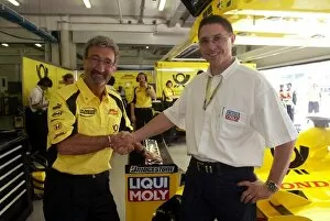 Images Dated 15th March 2002: Formula One World Championship: Jordan Team Owner Eddie Jordan with Peter Baumann the Marketing