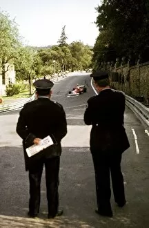 Images Dated 3rd April 2003: Formula One World Championship: Two Spanish policemen watch Niki Lauda Ferrari 312T circulate