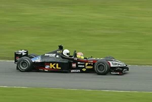 Images Dated 9th August 2002: Minardi Two Seater: Alex Yoong gives a lucky passenger the ride of their life