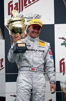 Images Dated 25th May 2003: Second placed Marcel Faessler (SUI), AMG-Mercedes, holding up his trophy