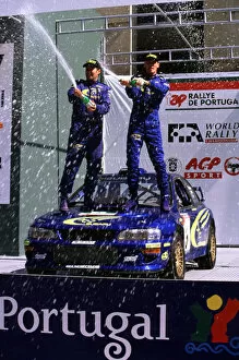Images Dated 20th March 2000: WRC-Richard Burns and Robert Reid celebrating win for Subaru