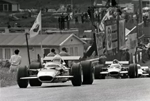 Images Dated 20th April 2006: Zandvoort, Holland. 21 June 1969: Jochen Rindt, Lotus 49B-Ford, retired, leads Graham Hill