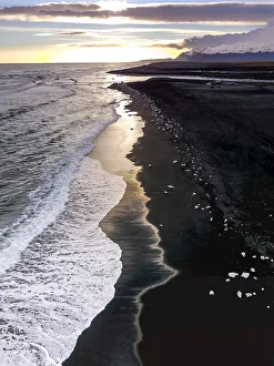 Aerial view of ice from the Jokulsarlon Glacier Lagoon on a black sand beach, Iceland Aerial view of ice from the Jokulsarlon Glacier Lagoon on a black sand beach, Iceland