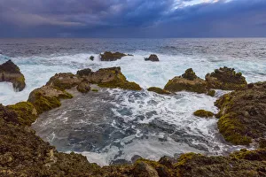 Atlantic Ocean and lava rock coast at dawn at Charco del Viento in La Guancha on Tenerife in the Canary Islands, Spain Atlantic Ocean and lava rock coast at dawn at Charco del Viento in La Guancha on Tenerife in the Canary Islands, Spain
