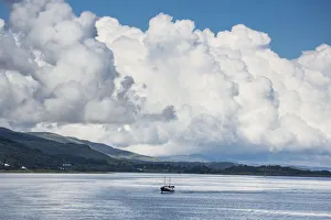 Billowing Cloud And A Boat In The Ocean Off The Coast; Isle Of Mull, Argyll And Bute Billowing Cloud And A Boat In The Ocean Off The Coast; Isle Of Mull, Argyll And Bute