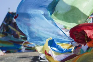 Blessing Colourful Tibetan Prayer Flags (Lung Ta) Under The Blue Sky; Tibet Blessing Colourful Tibetan Prayer Flags (Lung Ta) Under The Blue Sky; Tibet