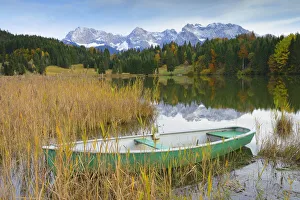 Boat on Lake Geroldsee with Karwendel Mountains, near Garmisch-Partenkirchen, Werdenfelser Land, Upper Bavaria, Bavaria Boat on Lake Geroldsee with Karwendel Mountains, near Garmisch-Partenkirchen, Werdenfelser Land, Upper Bavaria, Bavaria