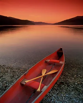 Canoe At Edge Of Mountain Lake, Shuswap, British Columbia, Canada Canoe At Edge Of Mountain Lake, Shuswap, British Columbia, Canada