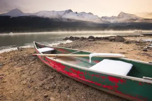 Canoe On Misty Fall Morning, Maligne Lake, Jasper National Park, Alberta Canoe On Misty Fall Morning, Maligne Lake, Jasper National Park, Alberta