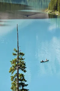 Canoeing On Turquoise Water Of Moraine Lake, Valley Of The Ten Peaks, Banff National Park Canoeing On Turquoise Water Of Moraine Lake, Valley Of The Ten Peaks, Banff National Park