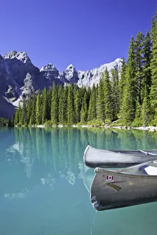 Canoes In Moraine Lake And Valley Of The Ten Peaks, Banff National Park, Alberta Canoes In Moraine Lake And Valley Of The Ten Peaks, Banff National Park, Alberta