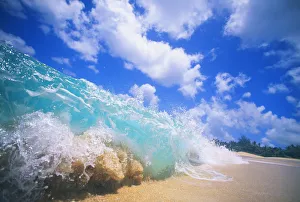 Closeup Action Of Shorebreak Ocean Wave, Turbulent Motion Blue Sky With Puffy Clouds Closeup Action Of Shorebreak Ocean Wave, Turbulent Motion Blue Sky With Puffy Clouds
