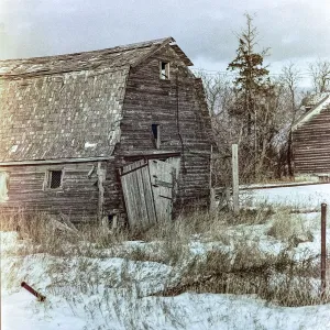 Dilapidated Barn on a Farmstead in the Countryside on the Canadian Prairies; Manitoba, Canada Dilapidated Barn on a Farmstead in the Countryside on the Canadian Prairies; Manitoba, Canada