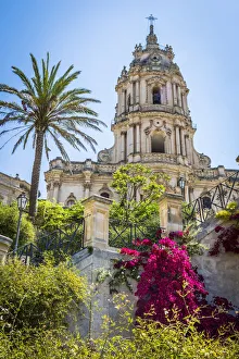 The dome of the baroque Cathedral of San Giorgio with gardens in historical Modica in the Provnice of Ragusa in Sicily The dome of the baroque Cathedral of San Giorgio with gardens in historical Modica in the Provnice of Ragusa in Sicily