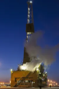 Doyon Oil Rig 14 on the road moving to another drill site in the Prudhoe Bay Oil Field, North Slope, Arctic Alaska Doyon Oil Rig 14 on the road moving to another drill site in the Prudhoe Bay Oil Field, North Slope, Arctic Alaska