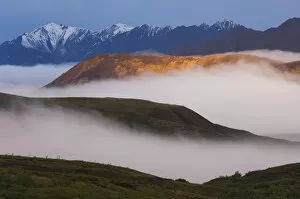 Images Dated 26th August 2006: Fog Settles Between Mountain Ridges At Sunrise In Sable Pass, Denali National Park, Alaska
