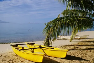 French Polynesia, Rangiroa, Kia Ora, Yellow Double Canoe On Beach French Polynesia, Rangiroa, Kia Ora, Yellow Double Canoe On Beach