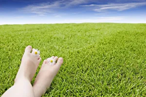 Girls Feet On Grass With Flowers Between Her Toes Girls Feet On Grass With Flowers Between Her Toes
