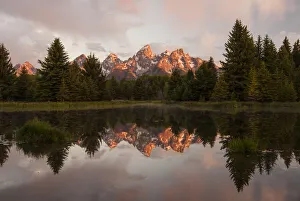 Grand Tetons reflected in Snake River, Grand Teton National Park, Wyoming, USA Grand Tetons reflected in Snake River, Grand Teton National Park, Wyoming, USA