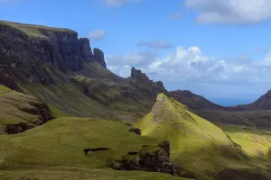 Grassy cliffs and mountain landscape on the Trotternish Peninsula on the Isle of Skye, Scotland, United Kingdom Grassy cliffs and mountain landscape on the Trotternish Peninsula on the Isle of Skye, Scotland, United Kingdom