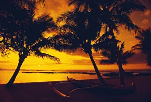 Hawaii, Big Island, Mauna Lani Beach Hotel, Ocean Sunset, Outrigger Canoe Resting On A Tropical Beach Hawaii, Big Island, Mauna Lani Beach Hotel, Ocean Sunset, Outrigger Canoe Resting On A Tropical Beach