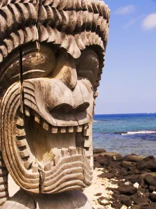 Hawaii, Big Island, Puuhonua O Honaunau, City Of Refuge, Close-Up Of Ki'i In Front Of Blue Sky And Ocean Hawaii, Big Island, Puuhonua O Honaunau, City Of Refuge, Close-Up Of Ki'i In Front Of Blue Sky And Ocean