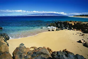 Hawaii, Lanai, Polihua Beach; Footprints In Sand, Rocks Around Beach, Molokai In Distance Hawaii, Lanai, Polihua Beach; Footprints In Sand, Rocks Around Beach, Molokai In Distance