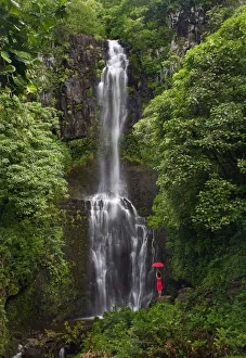Hawaii, Maui, Kipahulu, Hana Coast, Woman Stands With Umbrella At Wailua Falls Surrounded Hawaii, Maui, Kipahulu, Hana Coast, Woman Stands With Umbrella At Wailua Falls Surrounded