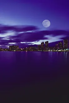 Hawaii, Oahu, Waikiki City Lights With Large Full Moon, Pale Purple Sky With Reflections Hawaii, Oahu, Waikiki City Lights With Large Full Moon, Pale Purple Sky With Reflections