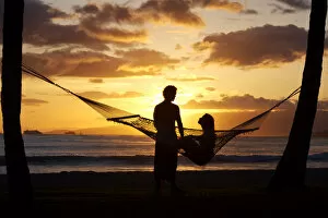 Images Dated 25th May 2007: Hawaii, Oahu, Waikiki, Kapiolani Park, Silhouette Of Woman In Hammock And Man Standing Next To Her