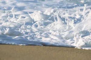 Hawaii, Ripple Of Water And Seafoam Breaks On Sandy Shore Hawaii, Ripple Of Water And Seafoam Breaks On Sandy Shore