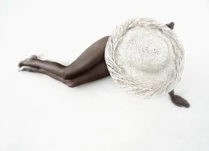 Hawaii, Woman Lays On The Sand With Straw Wide Brim Hat Hawaii, Woman Lays On The Sand With Straw Wide Brim Hat