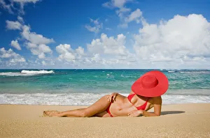 Hawaii, Woman Sitting On The Beach At A Remote Tropical Location Hawaii, Woman Sitting On The Beach At A Remote Tropical Location