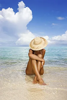 Hawaii, Woman Sitting In The Ocean At A Remote Tropical Location Hawaii, Woman Sitting In The Ocean At A Remote Tropical Location