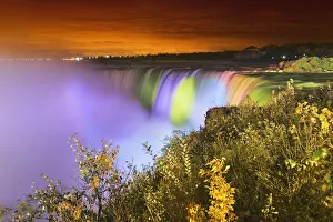 Horseshoe falls lit up at night; Niagara falls ontario canada Horseshoe falls lit up at night; Niagara falls ontario canada