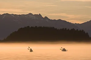 Kayakers Paddling Through The Misty Waters Of Favorite Passage, Near Sentinel Island Kayakers Paddling Through The Misty Waters Of Favorite Passage, Near Sentinel Island