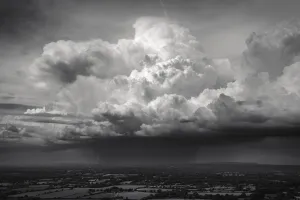 A line of towering cumulus clouds drifts across the English countryside; Brighton, East Sussex, England A line of towering cumulus clouds drifts across the English countryside; Brighton, East Sussex, England