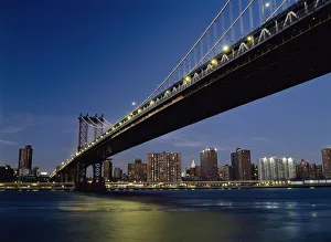 Looking Along Manhattan Bridge At Dusk Over The East River To The Lower East Side Looking Along Manhattan Bridge At Dusk Over The East River To The Lower East Side