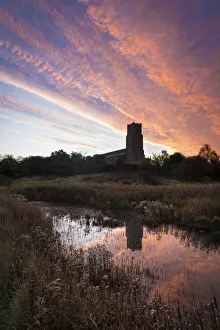 Looking over marshes at dawn to Blythburgh Church; Suffolk, England Looking over marshes at dawn to Blythburgh Church; Suffolk, England