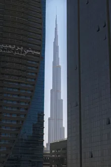 Looking Between Two Tall Office Buildings To The Burj Khalifa; Dubai, United Arab Emirates Looking Between Two Tall Office Buildings To The Burj Khalifa; Dubai, United Arab Emirates