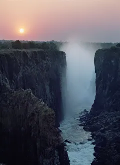 Looking Along Victoria Falls At Dusk From Zambia To Zimbabwe Looking Along Victoria Falls At Dusk From Zambia To Zimbabwe